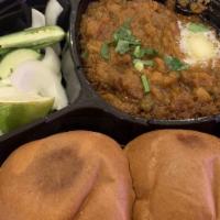 Pav Bhaji · Vegan. Mashed vegetables , peas, herbs and spices. Served with slider buns.