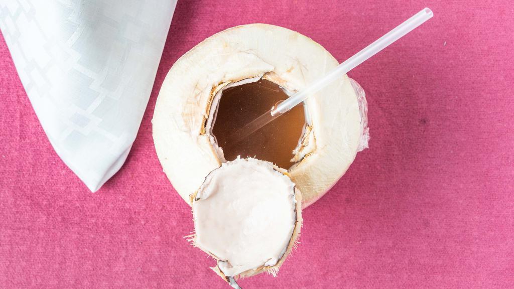 Coconut Smoothie · Free range young Thai coconut, juice and meat, a touch of banana and mango blended together.