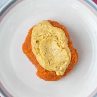 Raw Carrot Cake · Sounds gross but it's not.  Raw carrot fiber bonded with raw honey, ginger-lemon-almond fros...
