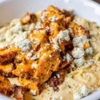 Macaroni & Cheese · Shell pasta mixed with house-made queso and garnished with panko bread crumbs.