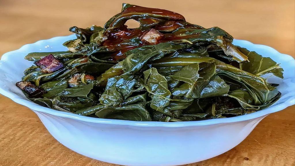 Bacon-Braised Collard Greens · Sauvie Island collard greens cooked within an inch of their life and finished with bourbon barrel aged hot sauce.