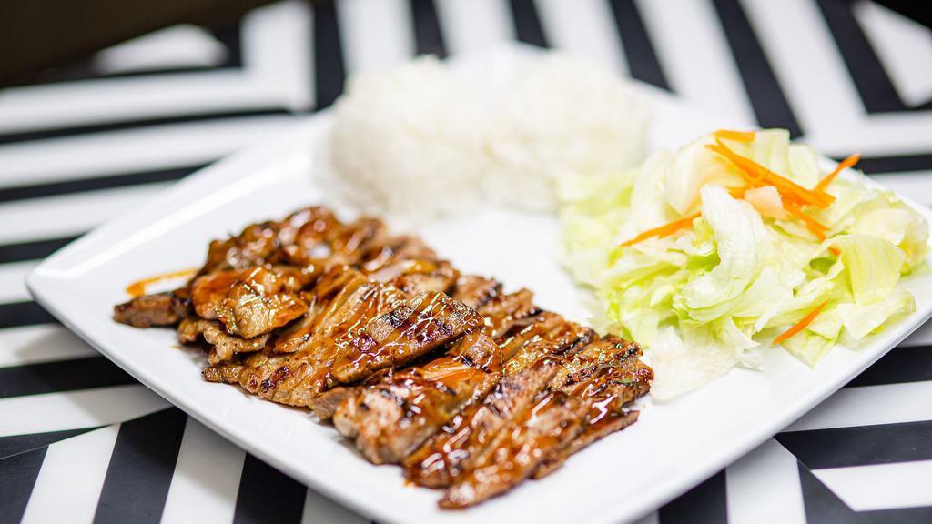 Chicken Teriyaki · Serving with rice and salad.