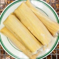 Tamale Plate · One tamale served with rice and beans.