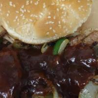 Brisket Sandwich  · Served with a Butter Toasted Bun and THE PLUGG BBQ Sauce.