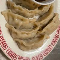 Steamed Dumplings · Choice of pork or chicken filled dumplings steamed, served with a side of house dipping sauc...