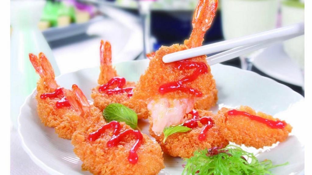 Fried Shrimp (9 Pieces) · Breadcrumb breaded shrimp deep fried served with a side of sweet & sour sauce.