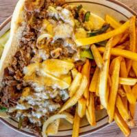 Philly Cheese Steak Sandwich · Served with sautéed onions, peppers & mushrooms, Swiss cheese & fries.
