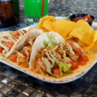 Cajun Shrimp Tacos · Grilled Cajun shrimp with chipotle mayo, shredded lettuce, dice tomatoes, drizzled with avoc...