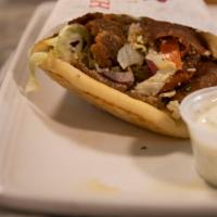 Gyros · Fresh hand-crafted gyros meat on a pita with lettuce, tomato, onion and feta cheese with hom...