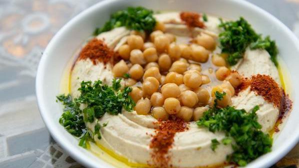 Hummus · Popular. Vegetarian, gluten-free. Palouse Farm's chickpeas, tahini, lemon, garlic, and Aleppo. (served with 3 pita).