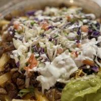 Asada Fries · French Fries topped with Carne Asada, Cheese, Pico, Guac, and sour cream.