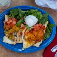 Stuffed Sopapillas · Customer Favorite.   

Two sopapillas stuffed with red or green chile, pinto beans, and your...