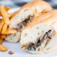 Philly Cheese Steak Sandwich With Fries · 