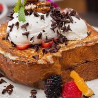 Stuffed French Toast · Our delicious brioche bread, stuffed with fresh banana and creamy Nutella® spread and drench...