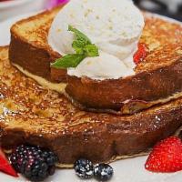 French Toast · Our delicious brioche bread, drenched in fresh cream and
egg batter, griddled to a golden br...