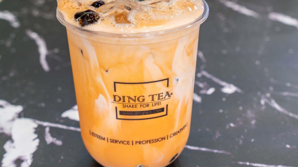 Thai Milk Tea · Aromatic and creamy thai milk tea made with Assam Black Tea, a blend of aromatic spices, and topped with a splash of half & half. Pairs well with golden boba, crystal boba, coffee jelly, or coconut jelly.