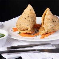 Vegetable Somosa · Our top quality ingredients potatoes, cilantro, green peas, and house spices wrapped in home...