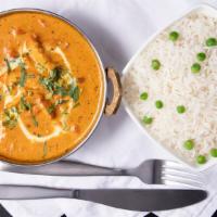 Chicken Makhani - Butter Chicken · Tandoori boneless chicken thigh chops cooked with fresh tomatoes, cashew nuts, onions, ginge...