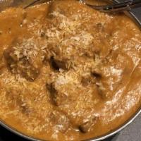 Lamb Coconut Curry · Lamb chops cooked with coconut milk, fresh tomatoes, onions, garlic, ginger, cashew nuts, go...