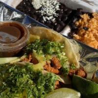 Tacos Combo With Drink · Two tacos corn tortilla, choice of meat, cilantro, onions, salsa chipotle, rice, black beans...