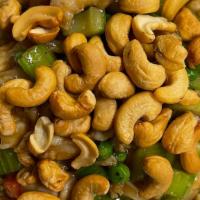 Chicken With Cashew Nuts · Diced chicken sauteed with diced celery, peas, carrots onion and cashew nuts.
