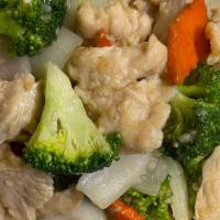 Chicken With Broccoli · Sliced chicken sauteed with broccoli, carrots and onion.