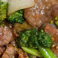 Beef With Broccoli · Sliced beef sauteed with broccoli, carrots and onion.