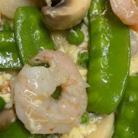 Prawns With Lobster Sauce · Prawns sauteed with peas, carrots, water chestnuts, mushrooms and baby corn.