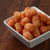 Tater Tot · A fan favorite, these classic tater tots are served gold-brown and crispy.