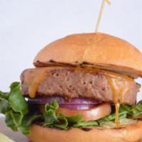 Veggie Classic Cheese Burger · Beyond burger patty topped with cheddar, tomato, red onion, lettuce, and pickles on a brioch...