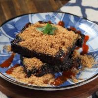 Black Rice Cake -Dihuigui (Non-Vegetarian) · Traditional black rice cake (made with pork blood). Served with house garlic sauce, red sauc...