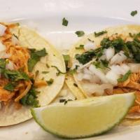 Tacos · Double corn tortillas with onion, and cilantro