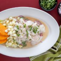 Ceviche Peruano · Marinated fish with lemon juice served with sweet potato, and purple onion