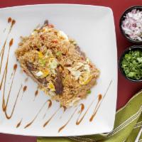 Arroz Chaufa Seafood · seafood mix, Fried rice, green onion, secret sauce, and egg