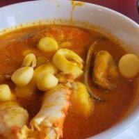 Parihuela · Paruvian seafood mix with crab leg, fish, and a secret sauce of the house