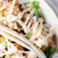 Baja Chicken Taco · Fire-grilled chicken marinated in lime juice and spices, topped with coleslaw and cilantro r...