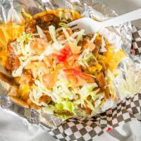 Frito Pie · Frito chips with chili con carne with your choice of lettuce, tomato and onions.