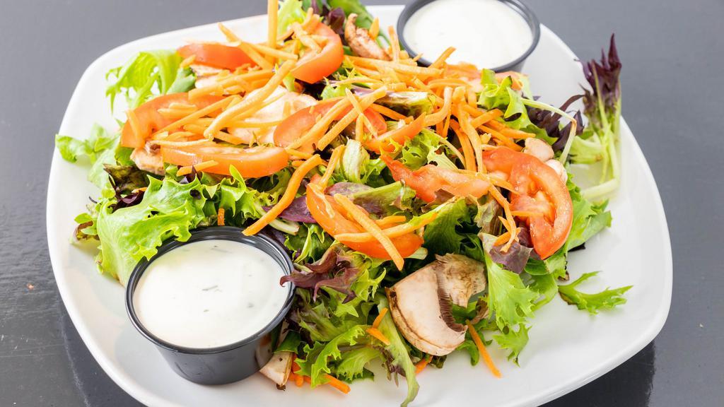 House Salad · Mixed greens, carrot, mushrooms, and tomato with house-made balsamic vinaigrette or ranch.