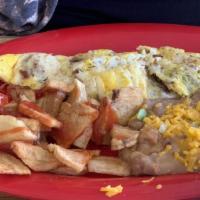 Bacon · Bacon inside of omelet. Plate served with beans, papas, and a tortilla
