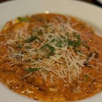 Lobster Ravioli · Lobster raviolis with asparagus, mushrooms, and shallots, smothered with vodka sauce.