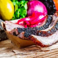 Brisket · Beef brisket, slow smoked for 14-18 hours. Rubbed with salt, pepper and coffee for a Texas t...