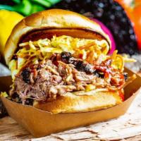 Pulled Pork Sandwich · Hand pulled to order, dressed in house made vinegar sauce, served on brioche bun, finished w...