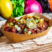 Brisket Chili · Ancho chilis, de seeded by hand, ample amounts of beef brisket and hot links. Served with ch...