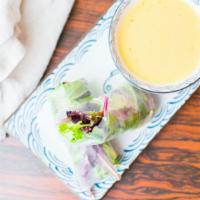 Vegetable Mango Salad Roll · Mango, avocado, cucumber and mixed-greens wrapped in rice paper, served with spicy mango sau...