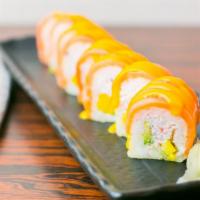 Ikiiki · Crab meat, avocado, cucumber and mango wrapped in soy
paper and topped with smoked salmon, d...