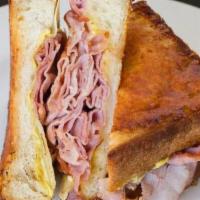 Croque Monsieur · Thin sliced ham layered between gruyere and Swiss cheeses. Grilled on grand central bakery b...