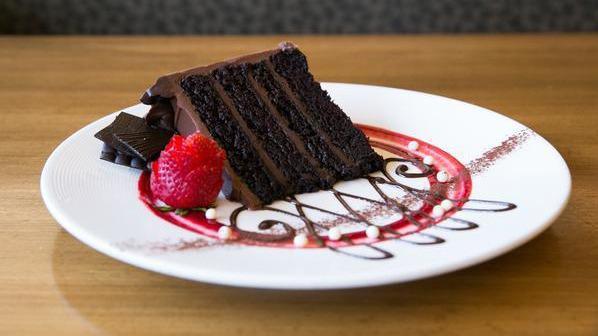 Triple Chocolate Cake · Caramel soaked chocolate buttermilk cake, dark chocolate and milk chocolate ganaches.