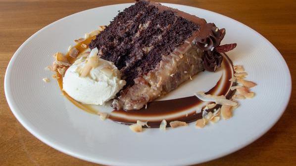 German Chocolate Cake · Chocolate buttermilk cake with layers of classic coconut-pecan filling, iced in milk chocolate ganache