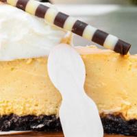 Tangerine & Vanilla Bean Cheesecake · Our famous NY Cheesecake with tangerines & vanilla bean, chocolate cookie crust, finished wi...