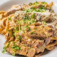Chicken Fettuccini · Comes with coconut, mushrooms, grilled chicken, bacon, garlic, onions, and white sauce.